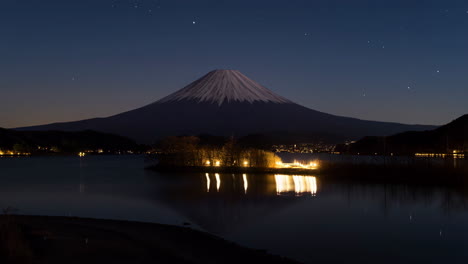mount fuji and lake kawaguchiko at night with starry sky