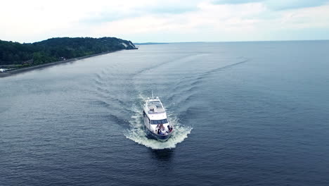 fashion shooting on motor boat. luxury yacht with top models sailing on river