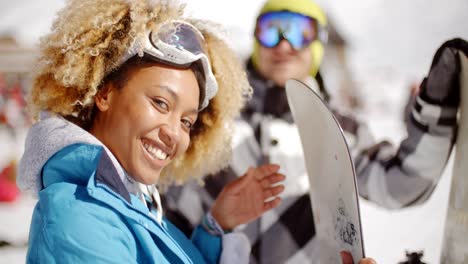 close up of skier holding snowboard