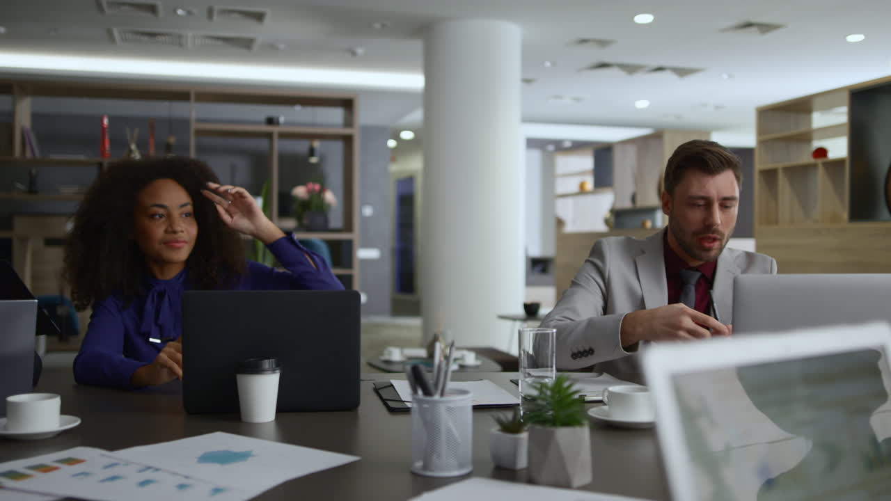 Multiethnic employees group talking