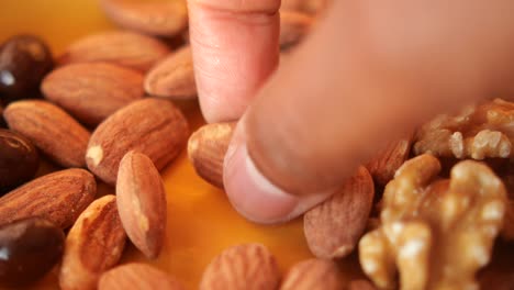 close-up of a mix of almonds, walnuts and chocolate