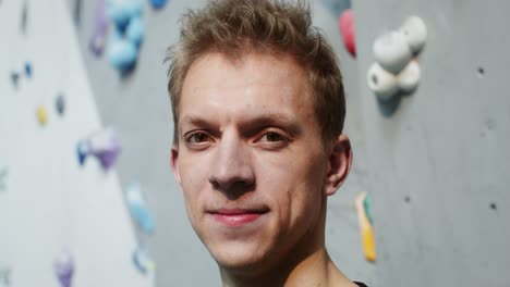 man smiling at the climbing gym