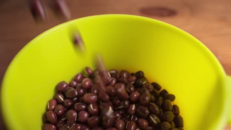 pouring red beans in to a bowl