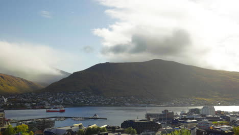 panning on tromso cityscape during cloudy morning in northern norway