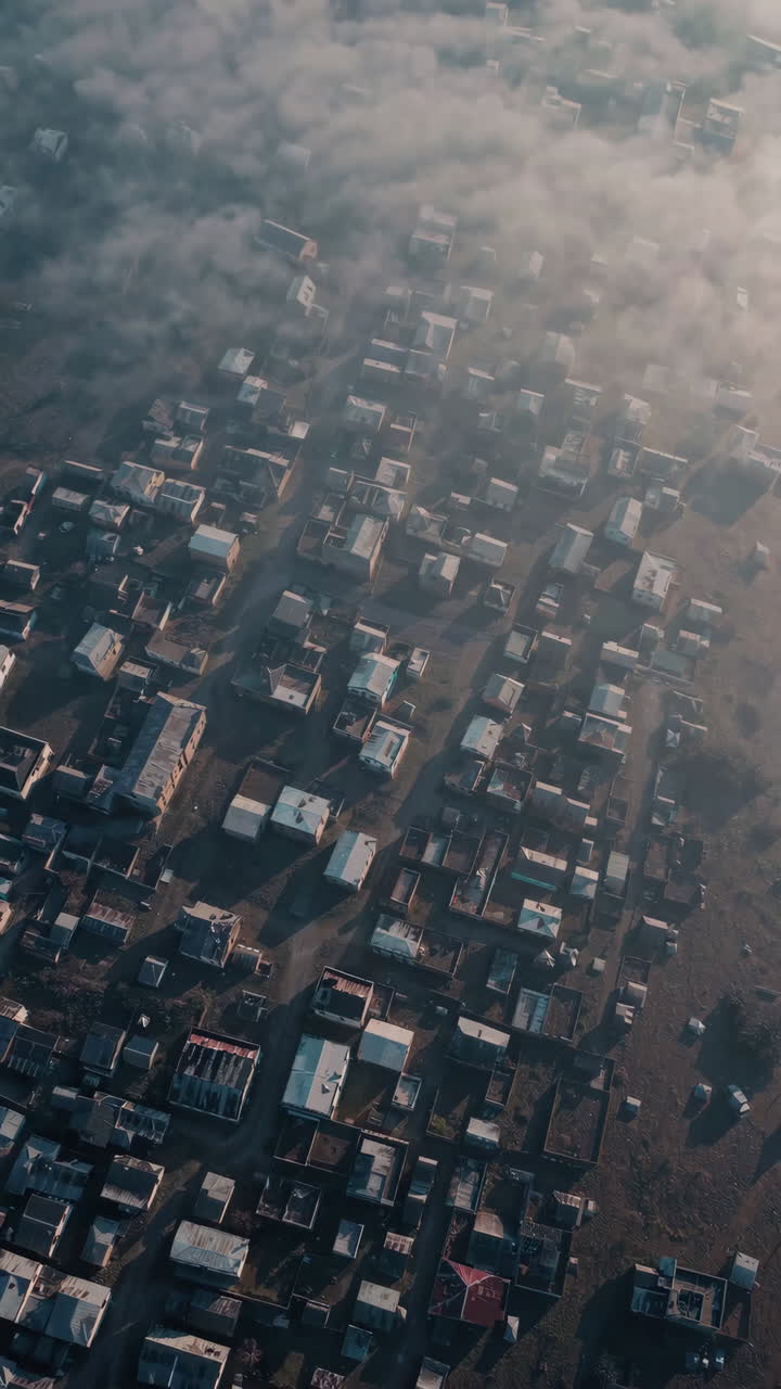 Aerial view of a village shrouded in morning mist