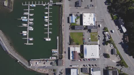 beautiful 4k rising birdseyeview pov of harbor and bustling coastal town in bandon, oregon