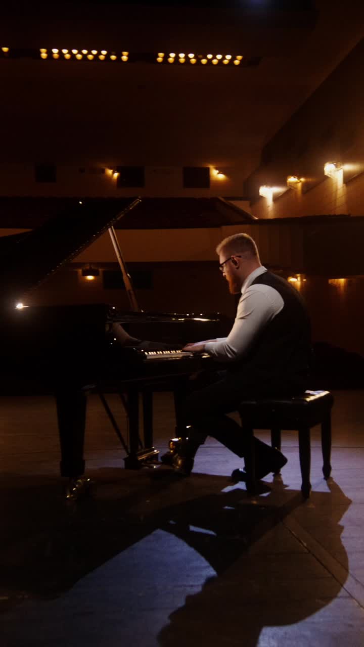 Pianist Playing Piano in Concert Hall