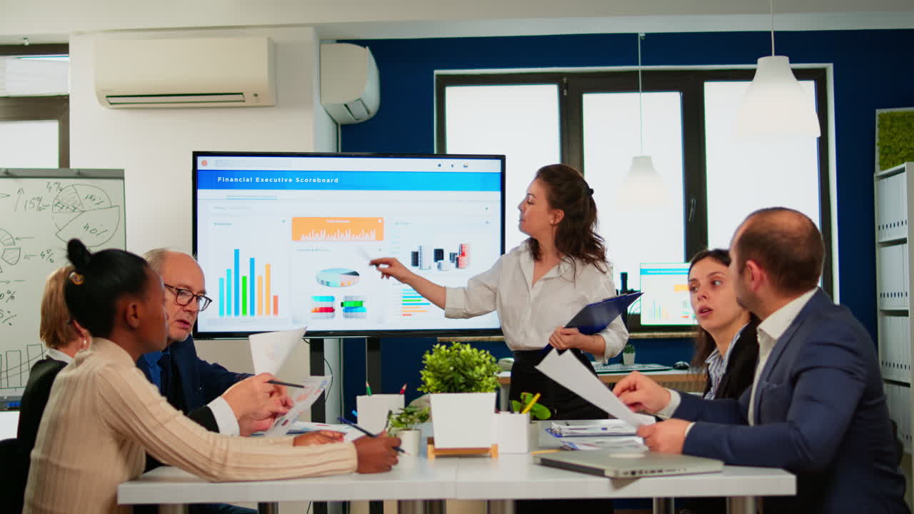 Team leader explain to multiracial workmates new project standing at desk