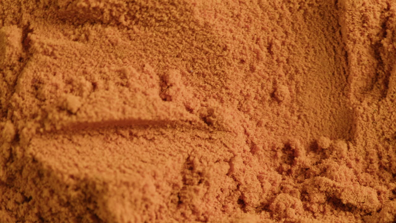 Close-up of Orange Powder Being Marked