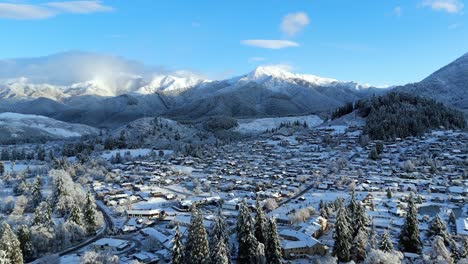 aerial view of snow covered mountain village of hanmer springs in new zealand at sunrise daylight landscape