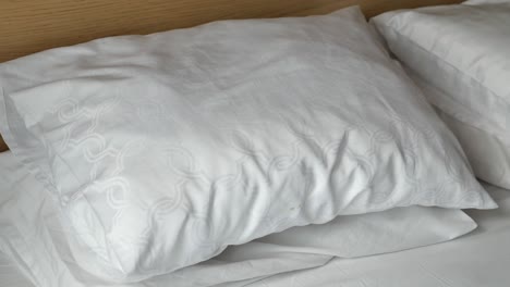 white pillows on a bed