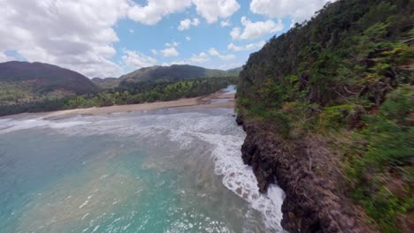 Fpv-drone-flight-over-Caribbean-Sea-and-river-mouth-of-tropical-Río-San-Juan-in-samana-during-beautiful-sunny-day---stunning-flight-over-nature