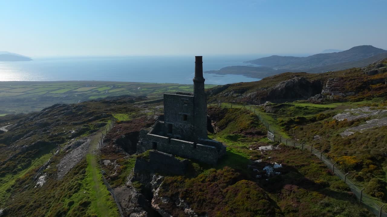Aerial View of a Stone Ruin on a Coastal Hillside in Ireland