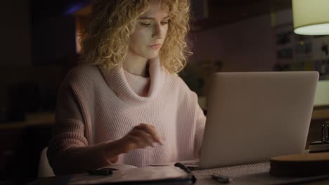 Handheld-video-of-woman-working-intensively-at-home