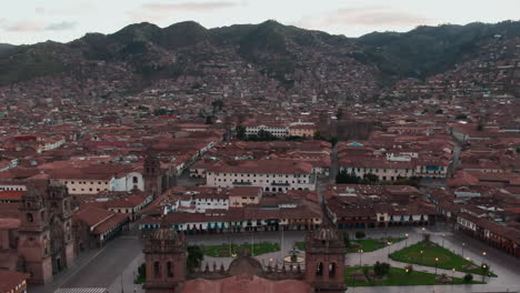 Aerial-capturing-Cusco's-historic-city-center-and-an-empty-Plaza-de-Armas