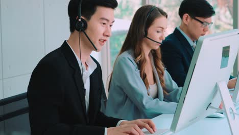 business people wearing headset working in office