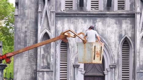 maintenance work on a historic building facade