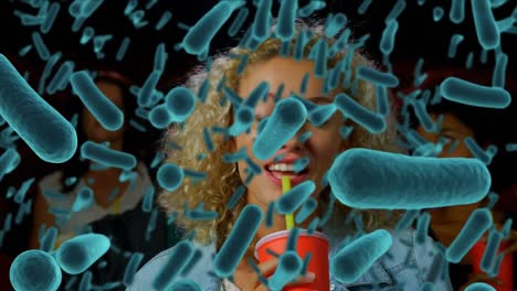 Animation-of-bacteria-cells-over-people-in-cinema