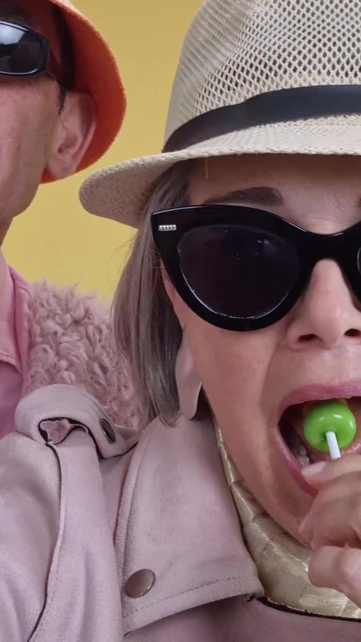 Playful senior couple dancing and taking a fun selfie together