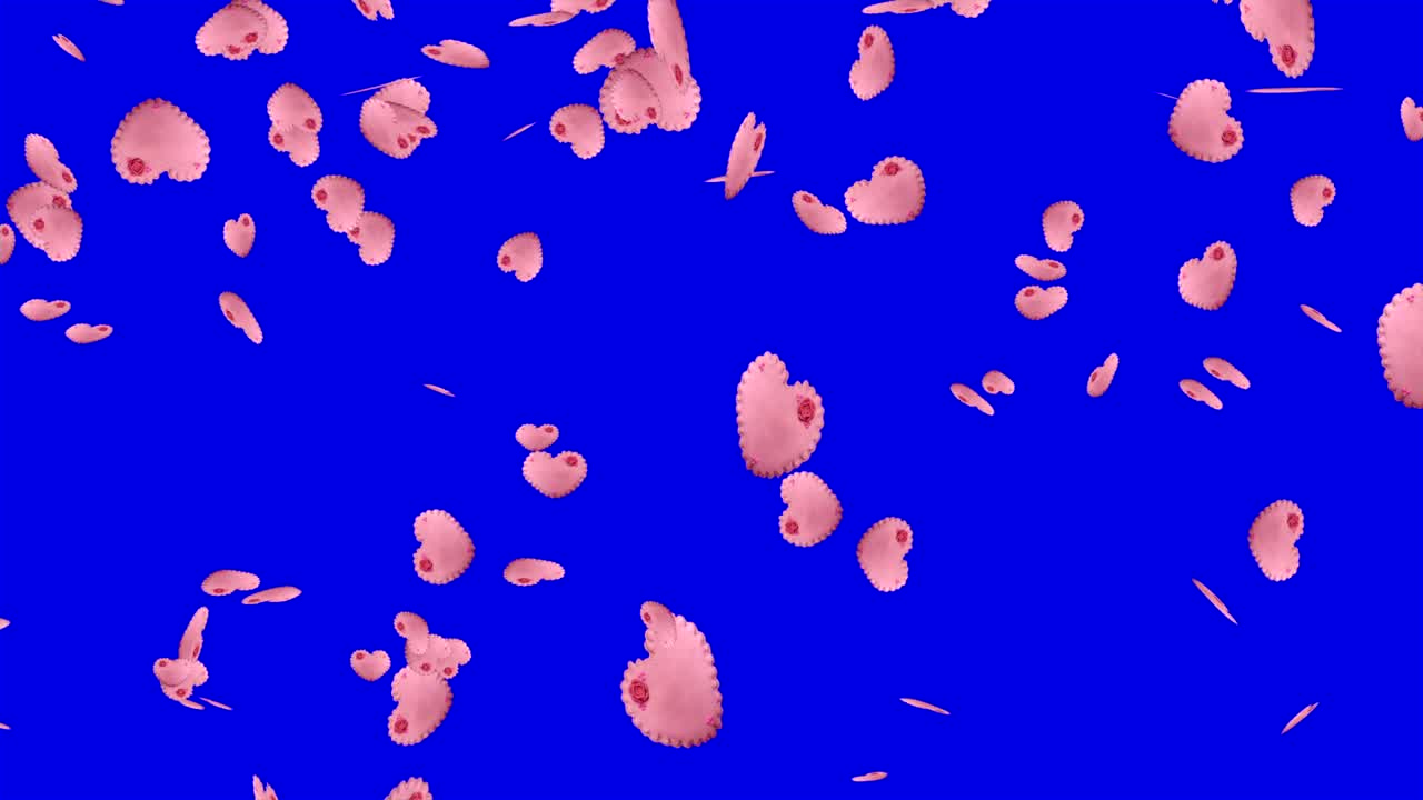 galletas rosadas en forma de corazón cayendo sobre el fondo azul