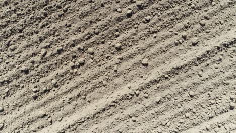 drone shot of farmland that has been ploughed to dirt