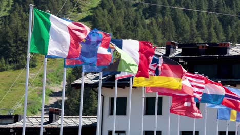 multiple national flags waving in the wind