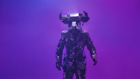 person in reflective bull costume on purple stage