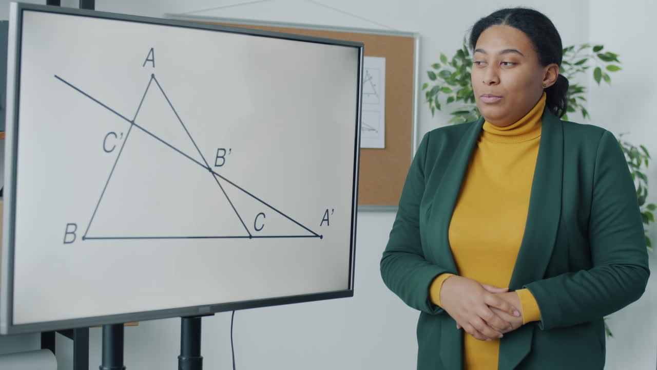 Teacher Presenting Geometry Lesson on a Screen