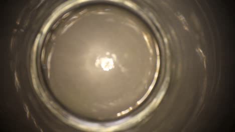 moving away from the bottom of a clear glass vase using a wide angle probe lens