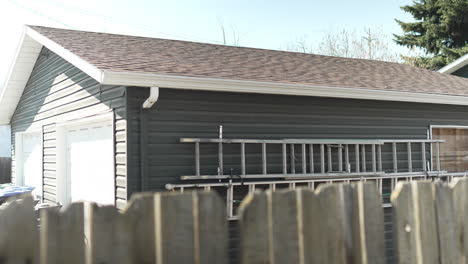 ladders attached to the outside of a garage