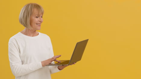 older woman using a laptop