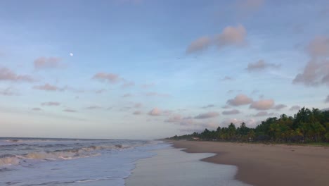 waves on a caribbean sea beach with beautiful skies during sunset