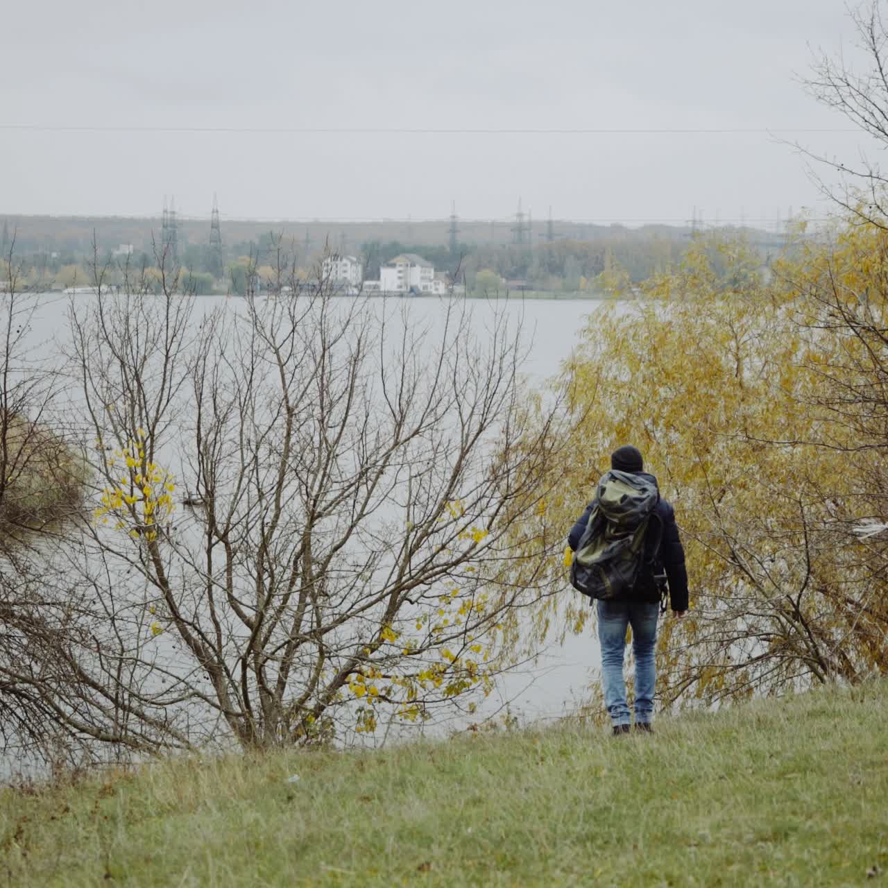 Man near river in forest