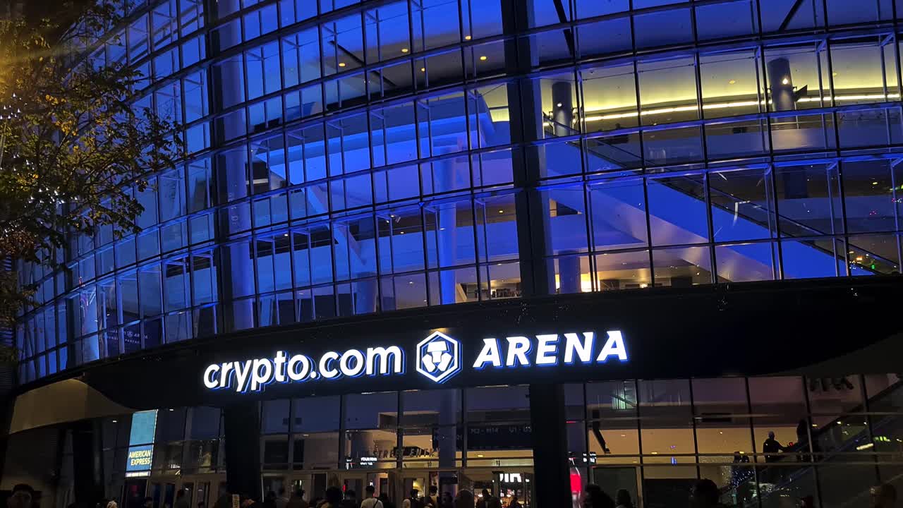 Night View of Crypto.com Arena with Blue Illumination and Crowds