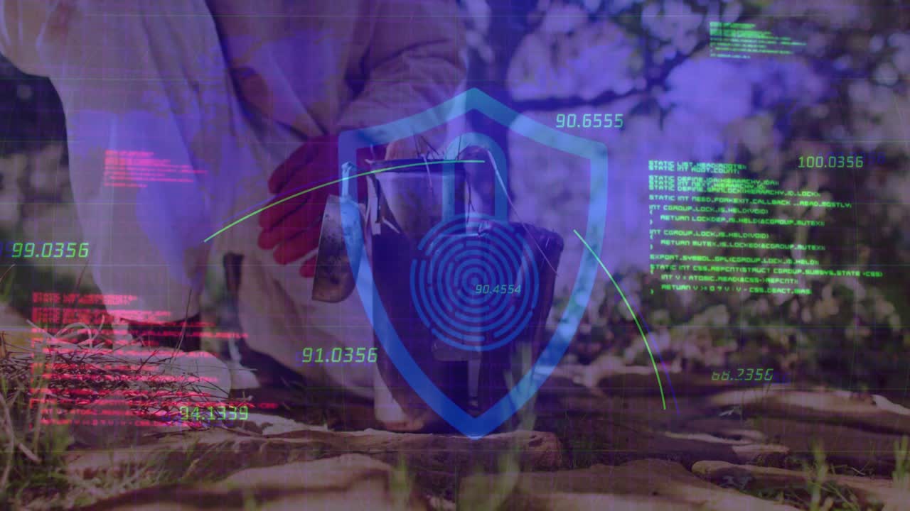 Kneeling man gathering twigs and pouring liquid into bucket showing security code on lock emblem