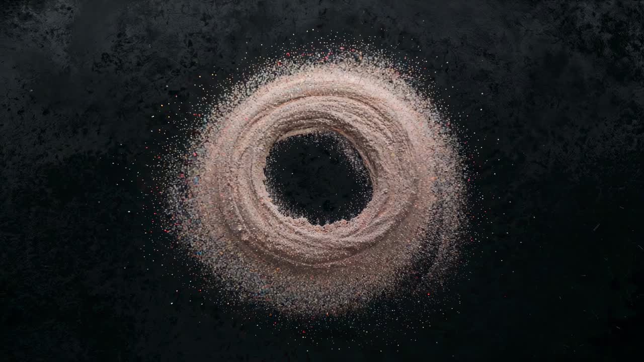 Spiraling powder ring tightening inward on plate by air pulse, forming central void and dust halo