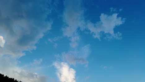 time lapse of clouds moving in blue