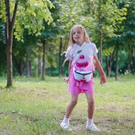 little girl dancing in the park