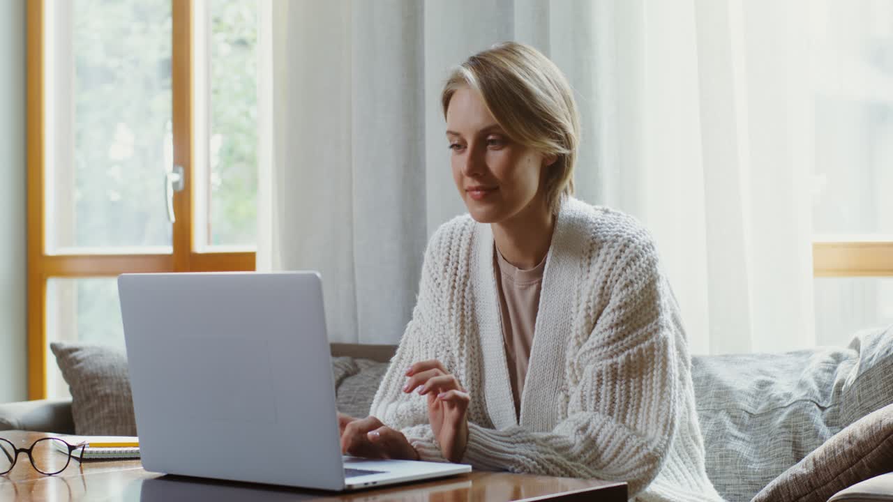 Woman having a video call at home