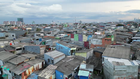 Drone-Rise-Over-Sunter-Lake-And-Surrounding-Slums-In-Jakarta-Indonesia-Cloudy-Afternoon