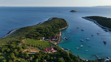beautiful aerial view of hvar island coastline with boats, green hills, and clear water