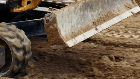 excavator moving on soil