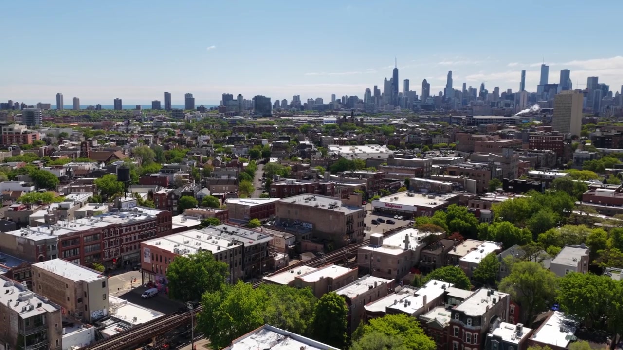 A rising drone shot from the Wicker Park Neighborhood, spinning to reveal the Chicago Skyline.