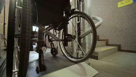 a girl in a wheelchair effortlessly ascends the stairs using a stair lift.