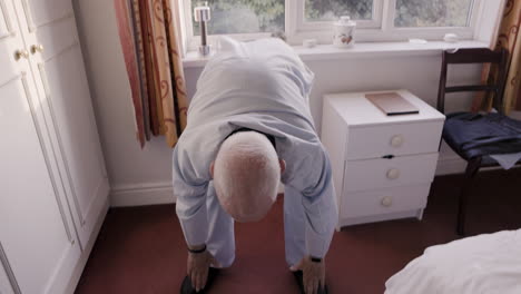 Man bending over in hotel room