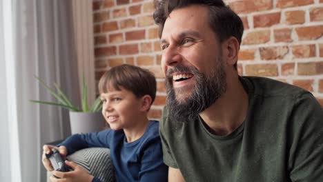 Video-of-father-and-son-having-fun-during-playing-game