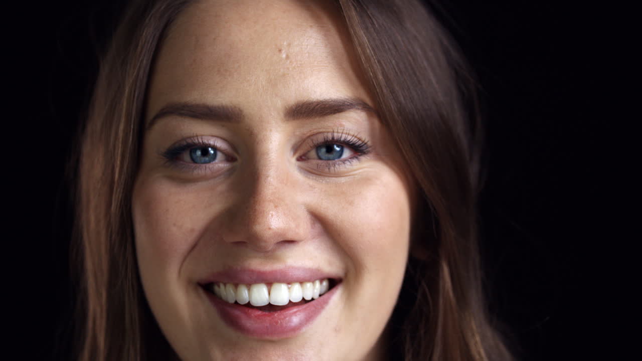Close Up Of Attractive Young Woman Laughing Into Camera