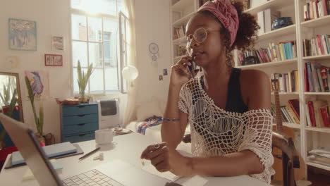 young african-american woman working remotely from home
