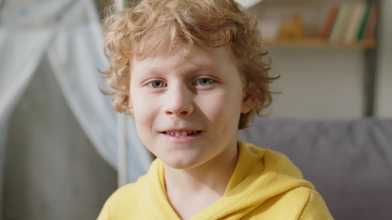 Portrait of Cheerful Boy at Home