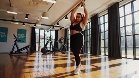 plus-size woman exercising in a gym